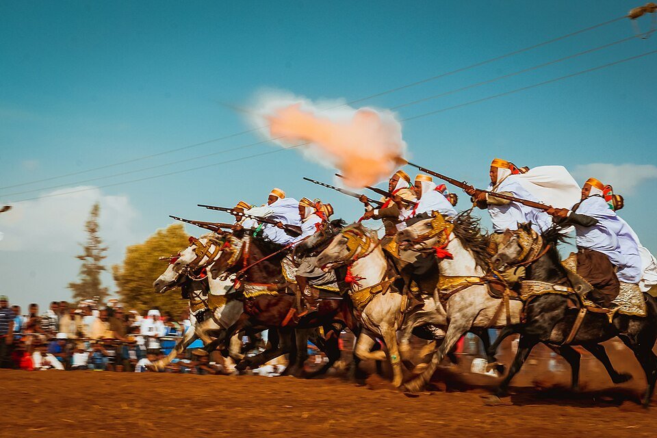 Tbourida riders charging together in formation